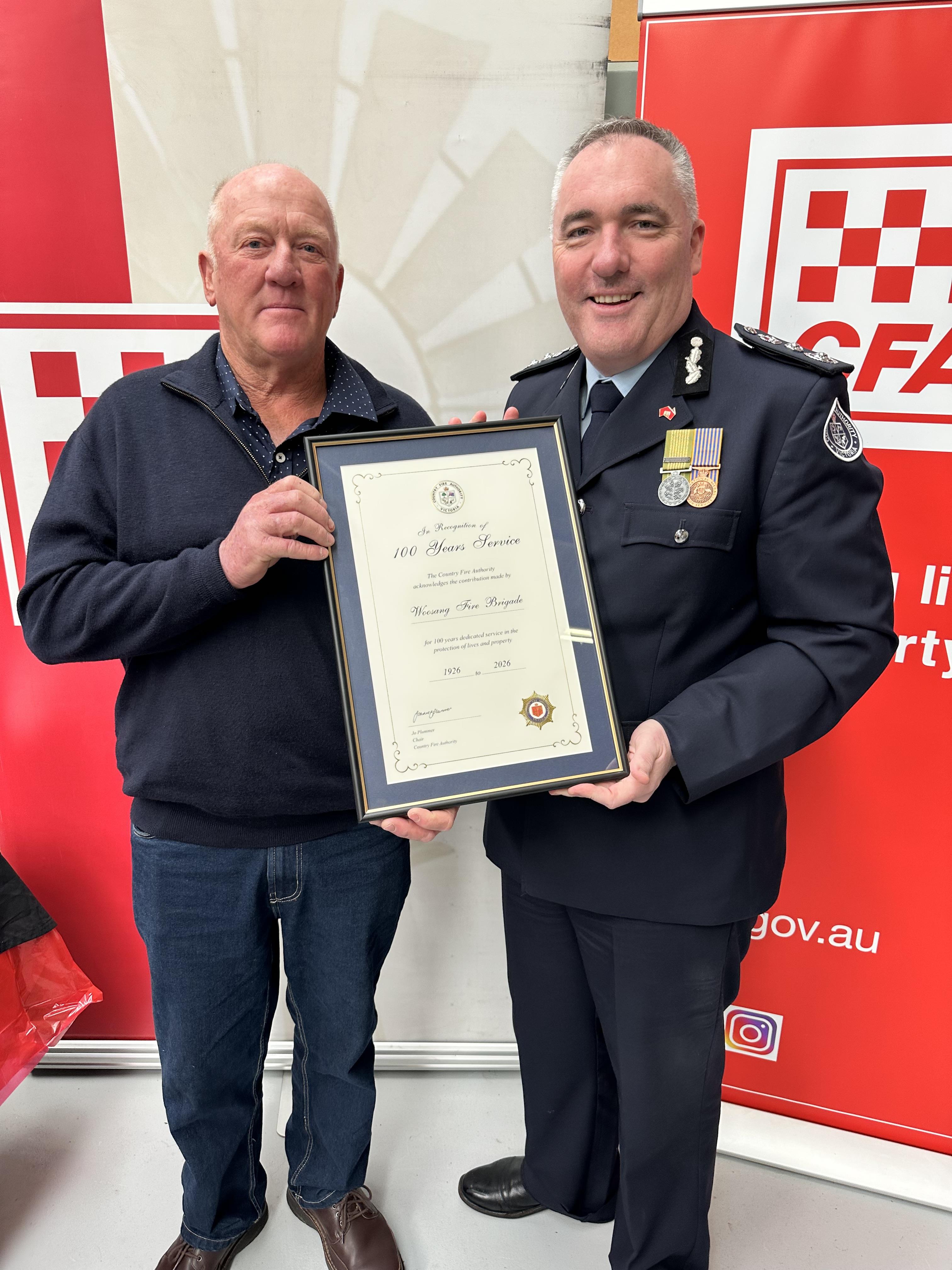 Captain Murray Gould receiving 100 year certificate